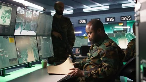 Man Working in a High Tech Military Control Room