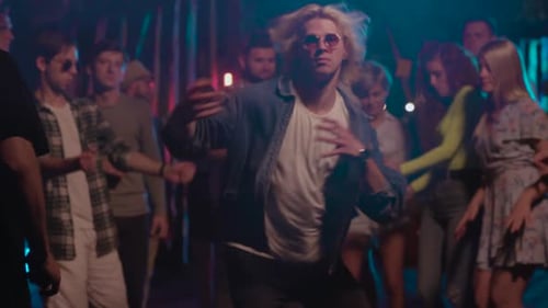 Enthusiastic Young People Enjoying a Nighttime Party