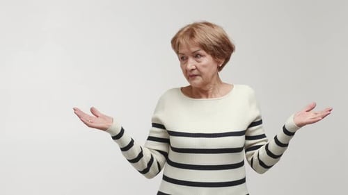 Woman Shrugging Shoulders, Hands Outward In Question