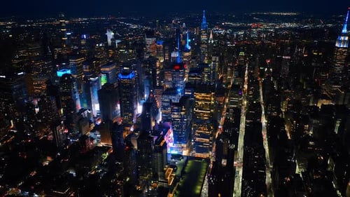 Cityscape sparkling with billions of lights. Majestic New York panorama at night. Aerial perspective