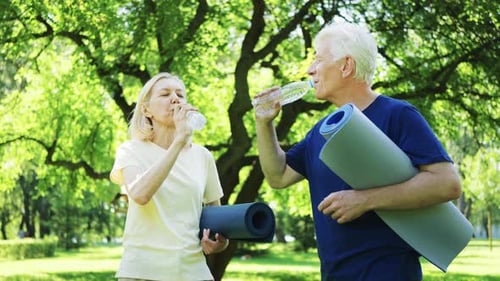 Seniors Hydrating After Workout