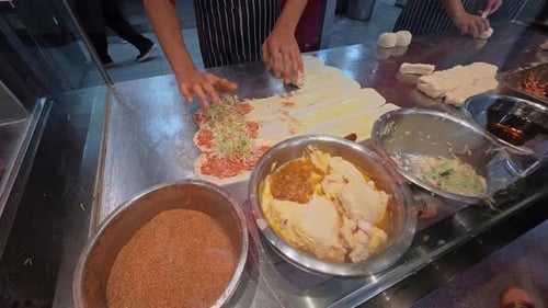 Stainless Counter With Culinary Craftsmanship Street Vendor Crafting Savory Meat Pastries Carefully