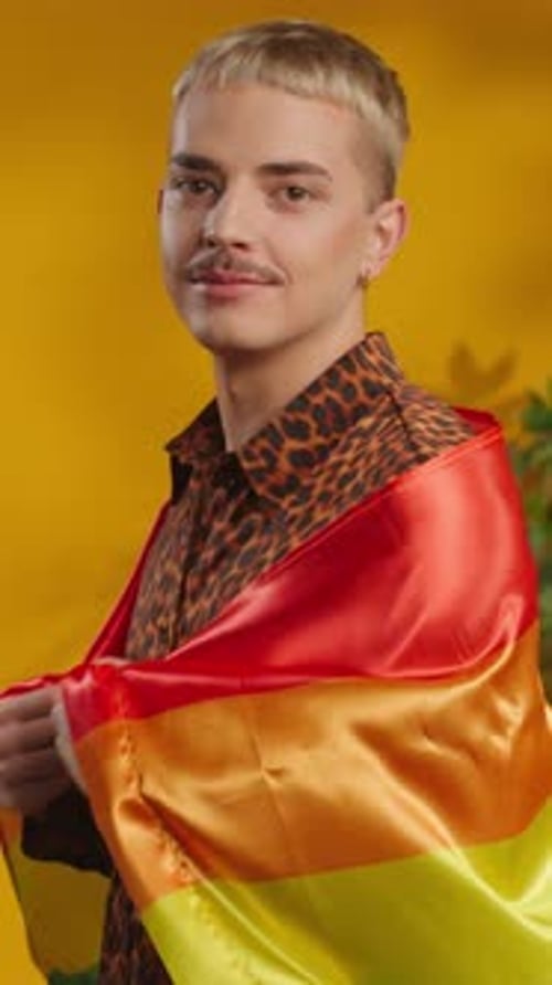 Young Adult Wrapped in a Rainbow Pride Flag