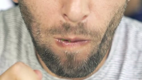 Funny, Happy Man Eating Salad Sitting In Cafe