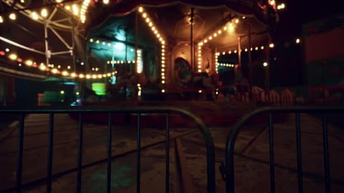 Abandoned Amusement Park at Night with Closed Attractions and Dim Lights