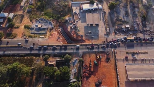 High angle Zoom in of traffic merging during roadside construction in Abuja, Nigeria