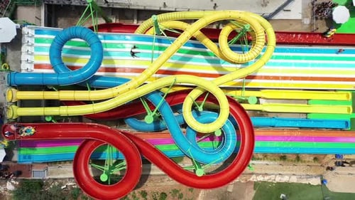 Aerial view of people sliding down a water slide at a water park