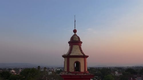 sunset in tlaltenango with close-up of its bell tower