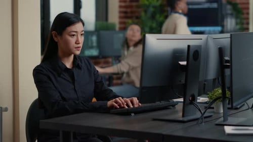 Asian Software Developer Troubleshoots Unexpected Code Error at Desk