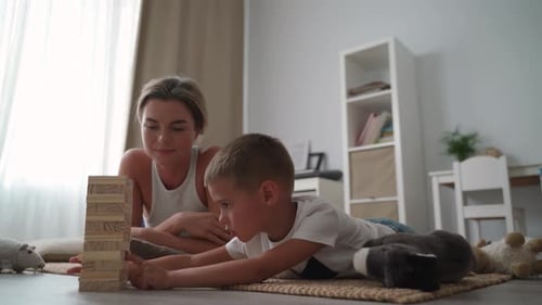 Woman and Child Playing Block Stacking Game