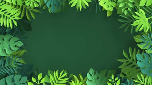 Paper leaves of a tropical palm tree on a green background