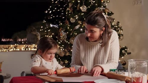 Family, Cooking And Winter Holidays Concept - Happy Mother And Baby Daughter With Rolling Pin And...