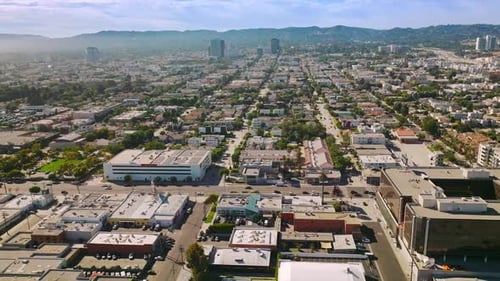 Sunny streets of urban modern Los Angeles at daytime. Lively city of California, USA