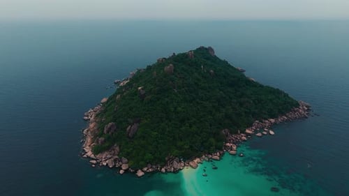 Tropical island, white sand beach and lush vegetation with lear turquoise water. Koh Tao Thailand
