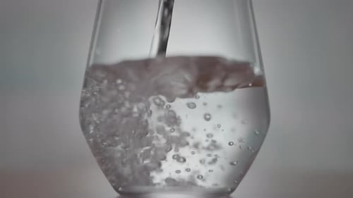 Pouring Refreshing Clear Water into Glass