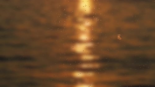 raindrop on windows, with a sunset view on the river blur background.
