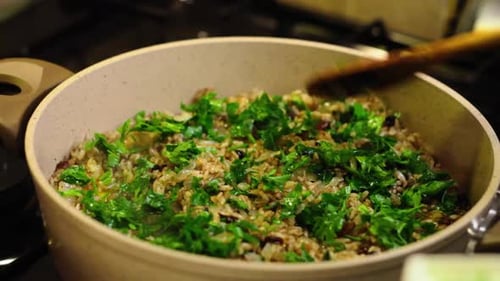 Preparing Food with Rice, Pumpkin and Herbs