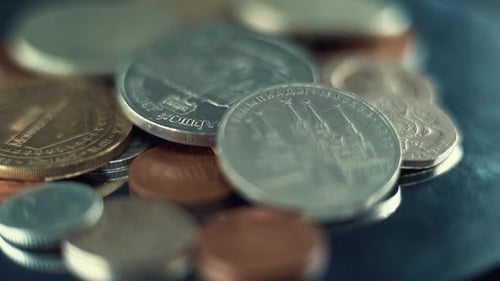 Pile of international coins in a close up shot