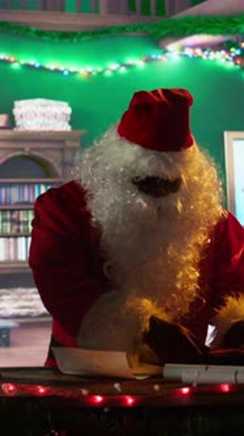 Vertical Video African American Father Christmas Decorates Boxes of Presents with Ribbons