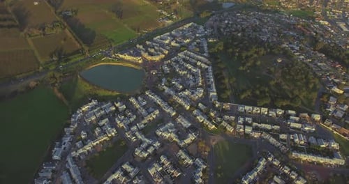 Property, houses in countryside with lake and drone, community in nature for agriculture
