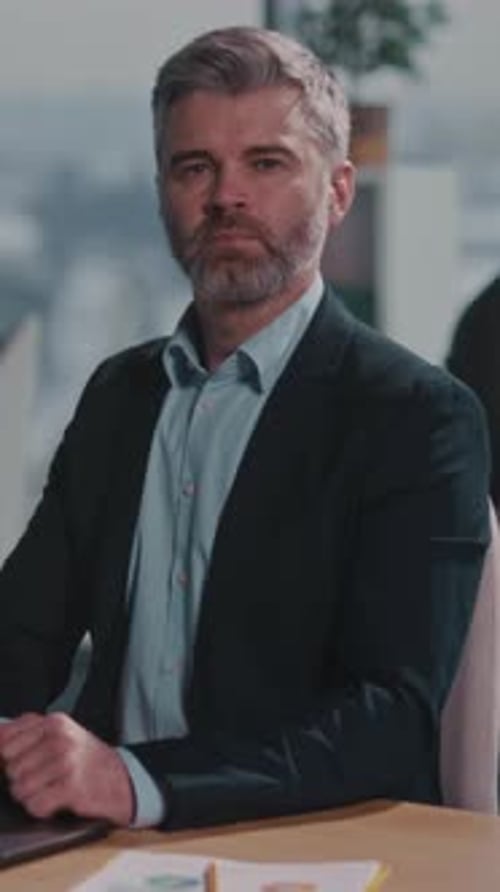 Individual Analyzing Project Timelines Diligently Professional Focused on Planning with City View