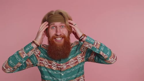 Adult Expressing Surprise and Delight on Pink Background