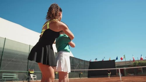 Tennis Lesson on Court on a Sunny Day