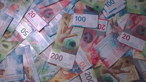 Pile of Swiss Francs Banknotes Overhead Shot