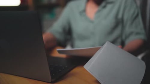CLOSE UP - Reading documents and analyzing documents, Asian businesswoman working hard and worrying