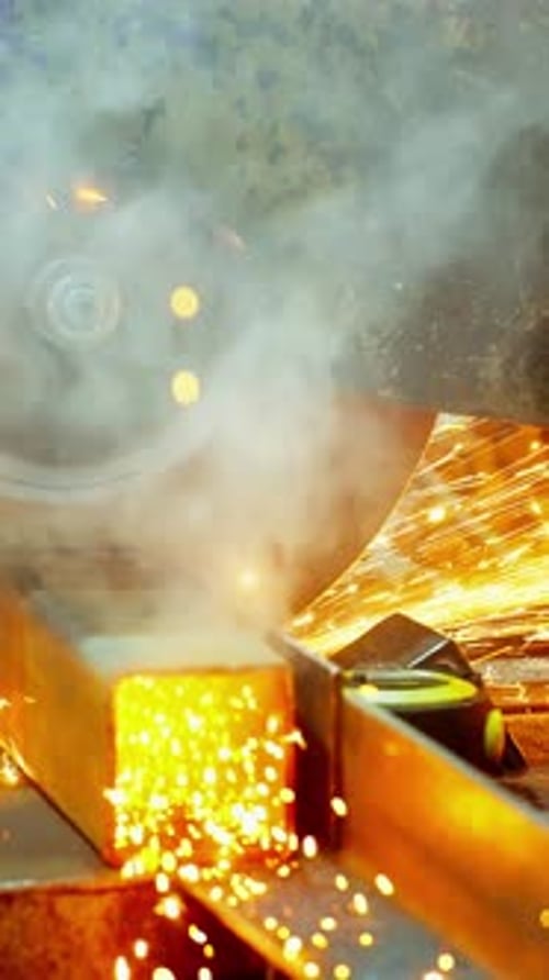 Sparks Fly During Metal Cutting Process in Workshop