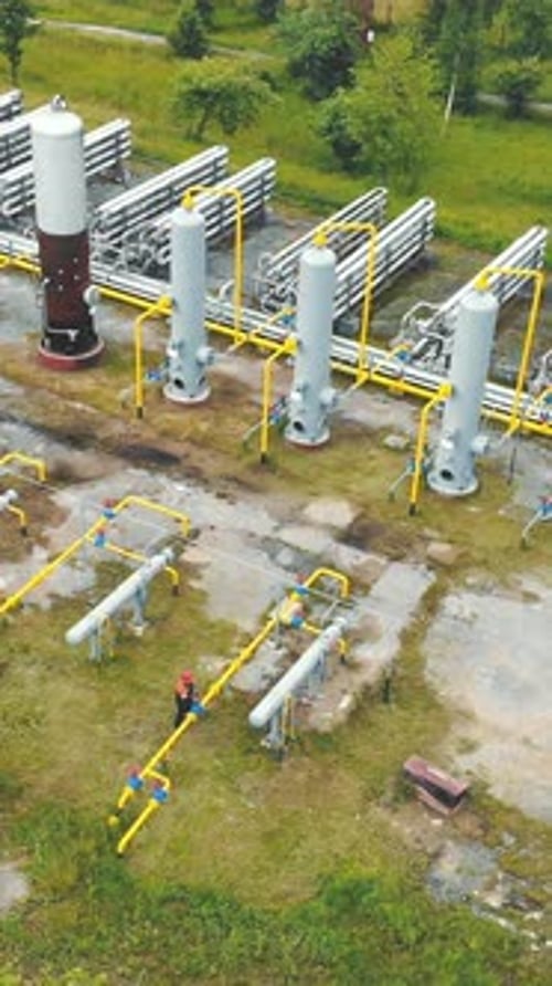 Aerial View Gas Production Large Gas Distribution Complex A Gas Worker or a Station Operator Shuts
