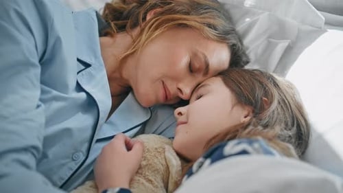 Mother Daughter Lying Bed Early Weekend Closeup Lazy Woman Kid Awaking Bedroom