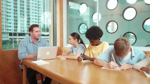 Smart teacher answer question while diverse student doing test. Edification