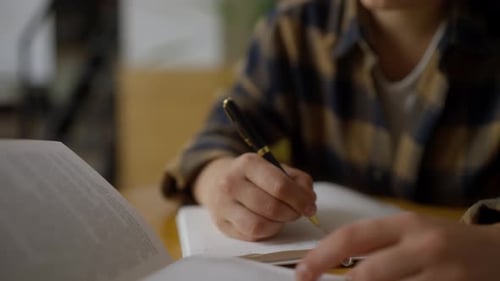 Adult Writing in Notebook with Fountain Pen Indoors