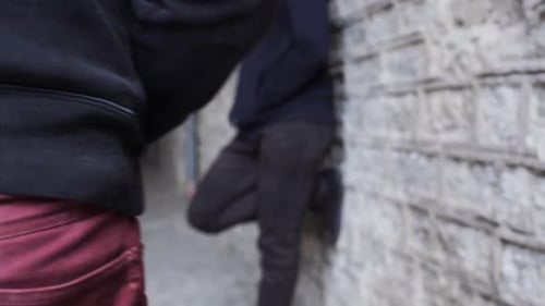 Drug dealer on street selling dose to addict in illegal crime trade