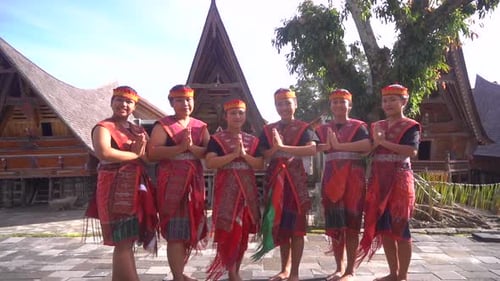 Young Adults Posing in Front of Rural Buildings