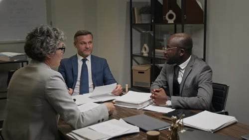 Lawyers Agreeing on Arguments for Court Trial and Shaking Hands at Meeting