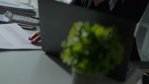 Reviewing Financial Data at Desk