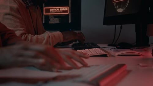 People Working On Computers in a Dark Room
