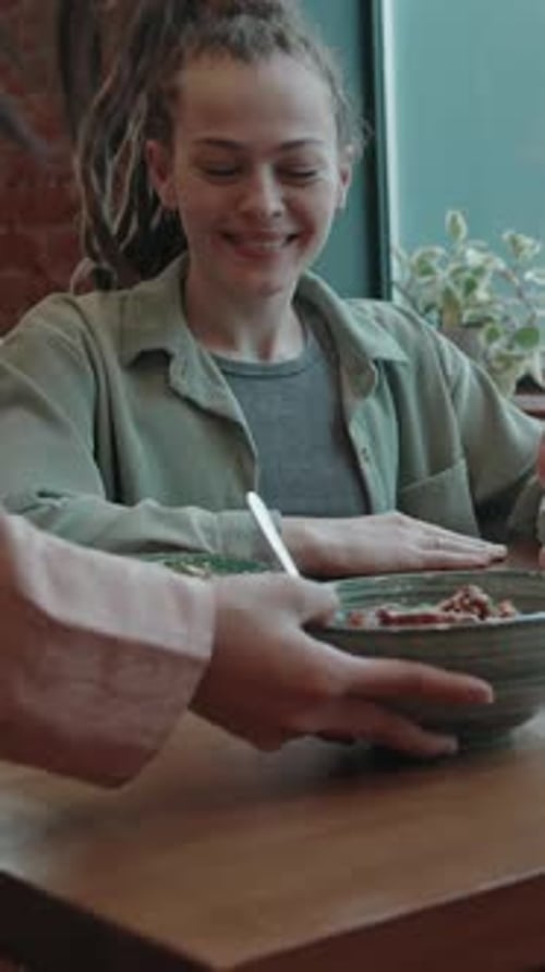 Female Customer, Smiling and Thanking Waitress for Bringing her Order in Cafe