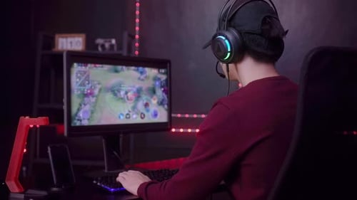 Intense Gaming Session: Young Player Engrossed in Game