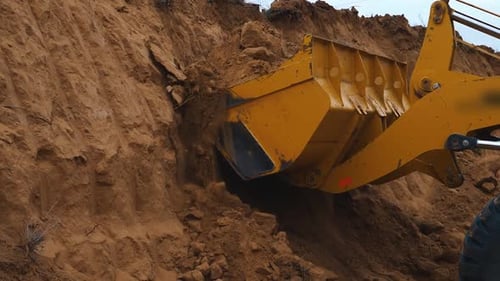 Excavator digging a quarry. Industrial construction. Preparing the area for construction