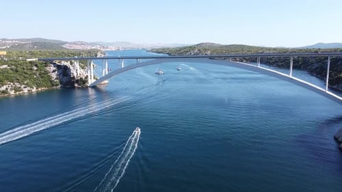 Sibenik Bridge at Krka River, Dalmatia, Croatia - Aerial Drone View of Sailing Boats, Arch Bridge an