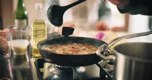 Cooking, hands and stirring with people in kitchen of home for preparation of meal or supper