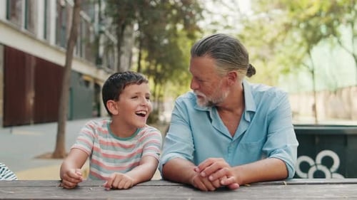 Grandfather and Grandson Enjoy a Day at the Park