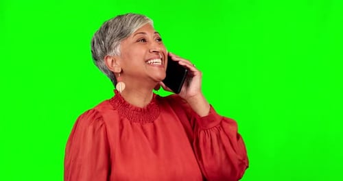 Phone call, happy and mature woman on green screen for funny conversation, chat and discussion