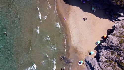Sea shore or seashore waves crashing by the seashore. Aerial drone view of wild beach in the coastli