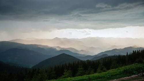 Mountain Landscape Under Golden Sunlight and Cloudy Sky