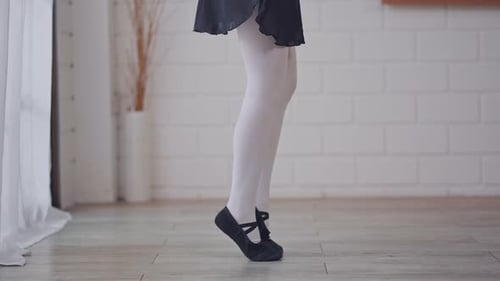 Close up of beautiful woman practice dancing ballet rehearsing at home