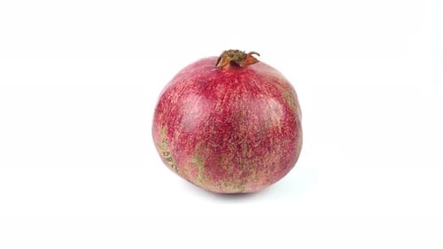 Delicious Ripe Pomegranate Fruit On A Background.